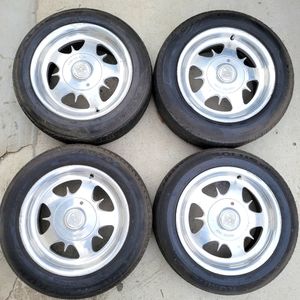 Centerline 15inch rims with center caps %65 tires